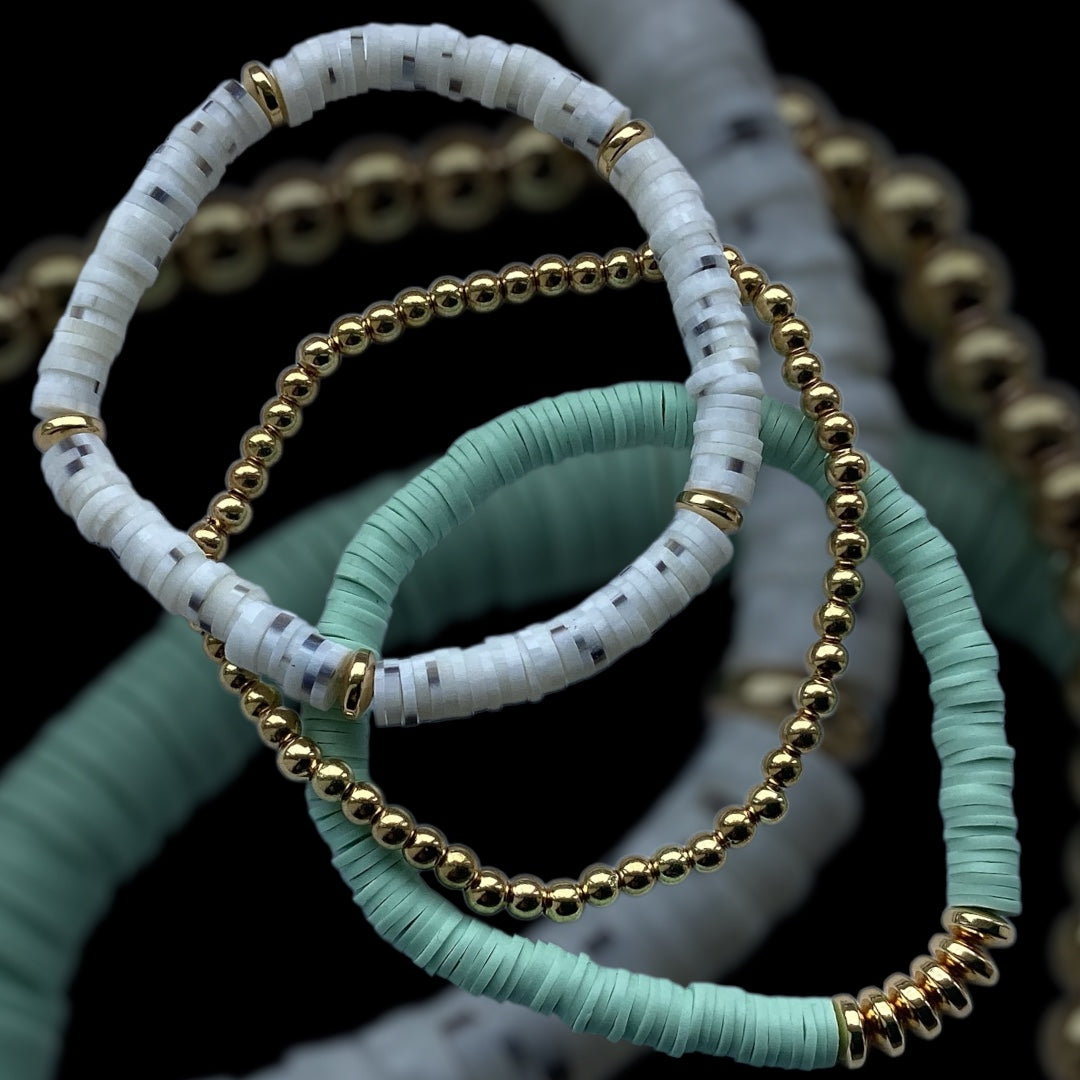 Mint Cloud bracelet stack – mint green and white with gold accents
Handmade soft-toned bracelet trio with flecked beads and gold spacers
Mint and gold 3-piece stretch bracelet set – Mint Cloud by Pxl Nate
Lightweight bracelet stack with polymer discs and gold beading
Minimalist bracelet set in calming colours – UK handmade