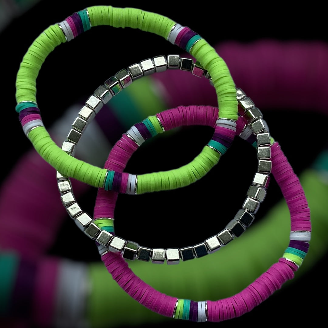Magenta Pop bracelet stack – lime and magenta beads with silver cube accents
Handmade 3-piece bracelet set with silver square beads and bright colours
Stretch bracelet trio in magenta, green, and silver – Magenta Pop by Pxl Nate
Bold and colourful jewellery set with cube spacers and polymer discs
Bright handmade bracelet stack with cool-tone contrast – UK made