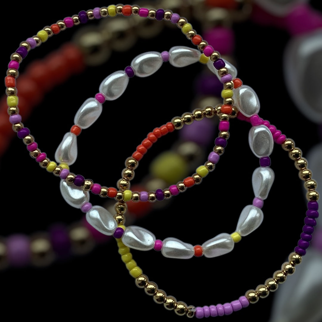 Electric Pearls bracelet stack – colourful beads with pearl drops and gold accents
3-piece handmade stretch bracelet set with pearl-look beads and vibrant colours
Festival-ready beaded bracelet stack – Electric Pearls by Pxl Nate
White pearl drop and gold bead bracelet trio with rainbow seed beads
Bold and shiny stretch bracelet set – handmade in the UK