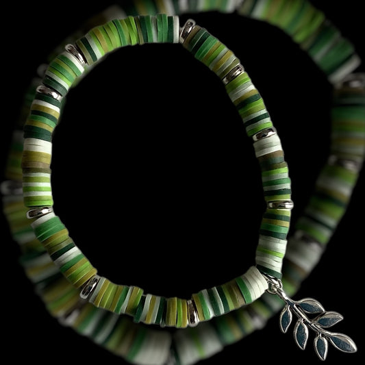 Handmade green beaded bracelet with silver leaf charm

Botanical-inspired bracelet in jade and soft green tones

Meadow Fern bracelet with nature-inspired colours
