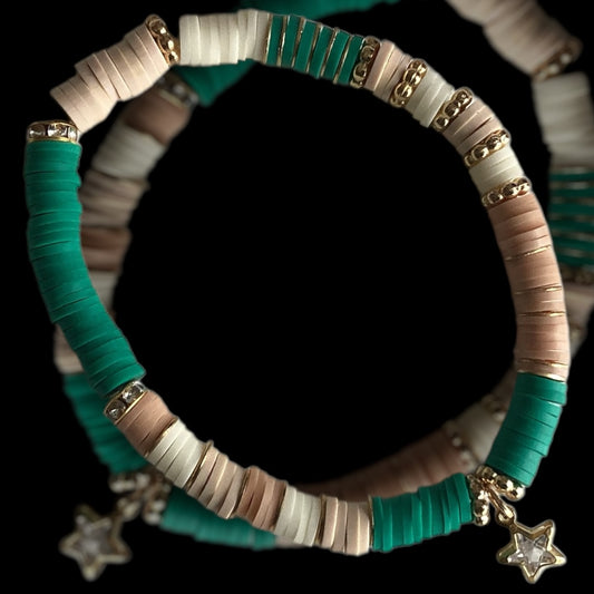 Handmade green beaded bracelet with gold star charm

Celestial Jade bracelet in teal and jade tones

Polymer clay bracelet with star detail in gold

